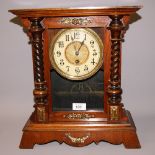 An American mahogany cased mantel clock with single glazed display door