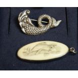 A silver-mounted ivory-type oval panel with scrimshaw-decoration depicting a frog,