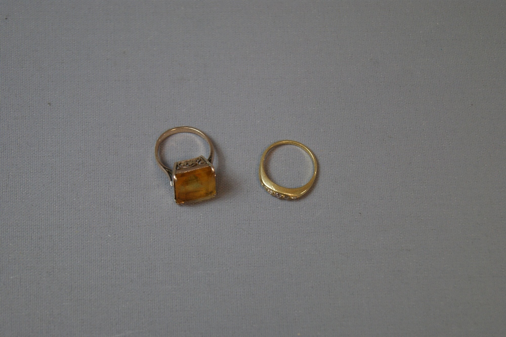 Two unmarked yellow metal ladies dress rings,
