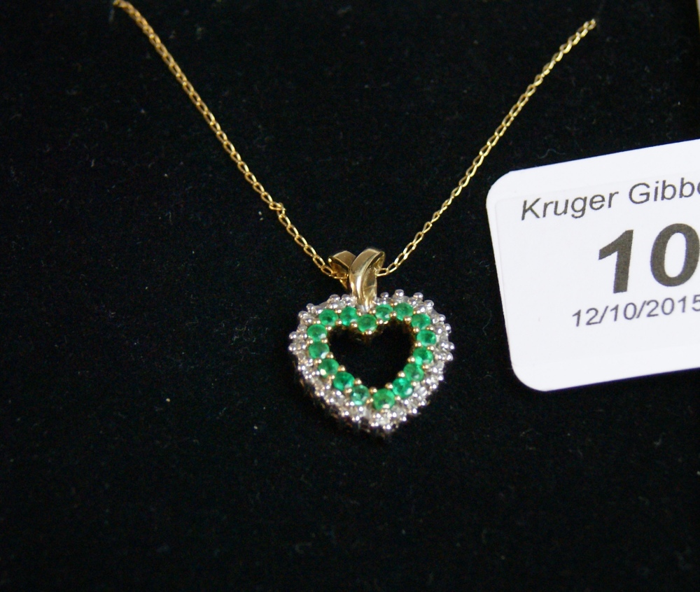 Antique 9ct. gold, emerald and diamond pendant complete with 9ct. gold chain.