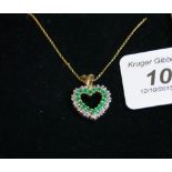 Antique 9ct. gold, emerald and diamond pendant complete with 9ct. gold chain.