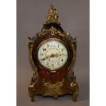 A lacquered brass, ormolu and lacquered Boulle clock,