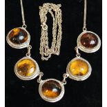Hallmarked silver necklace with amber setting,