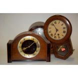 An oak cased dome top mantel clock, one