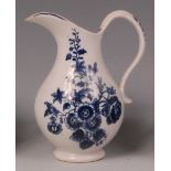 A Lowestoft porcelain helmet form jug, circa 1775, blue and white printed in the Three Flowers