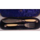 A cased pair of late Victorian silver and ivory handled fish servers, each having pierced and