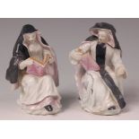A pair of mid-18th century Bow porcelain figures of an Abbess and Nun, each seated upon a mound