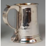 An early George III silver tankard, the S scroll handle with single monogram, gilt washed