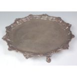 A George II silver salver, having a shall cast piecrust rim, engraved ground with later presentation