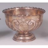 A late Victorian silver pedestal rose bowl, having vacant cartouche and of half spiral reeded and