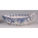 An 18th century Worcester porcelain sauceboat, of ribbed pear shape, underglaze blue decorated