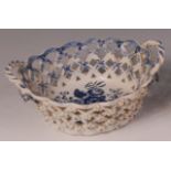 A Lowestoft porcelain chestnut basket, lattice worked, blue and white printed in the Pinecone