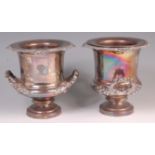 A pair of late Victorian silver plated pedestal wine coolers and liners, each with inset engraved