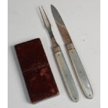 A leather cased pair of George III silver and mother of pearl travelling fruit knife and fork,
