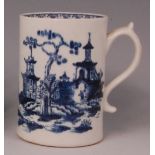 A Lowestoft porcelain tankard, circa 1780, blue and white printed with a Chinoisserie landscape, h.