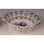 A Lowestoft porcelain chestnut basket, lattice worked, blue and white printed in the Pinecone