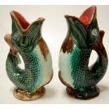 A pair of Victorian pottery fish vases Condition Report / Extra Information One vase with firing
