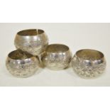 A set of four Indian embossed white meta