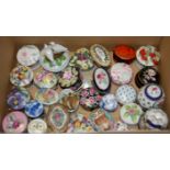 A collection of porcelain trinket boxes