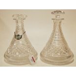 A pair of cut glass ship's decanters, on