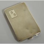 An Art Deco silver ladies powder compact, having an engine turned exterior, typical hinged action,