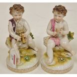 A pair of continental porcelain cherub f