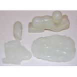 Four Chinese celadon jade carvings to include; dragon and crouching rabbit Condition Report /