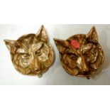 A pair of cast brass wall plaques each i