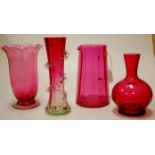 Four pieces of cranberry glassware to in