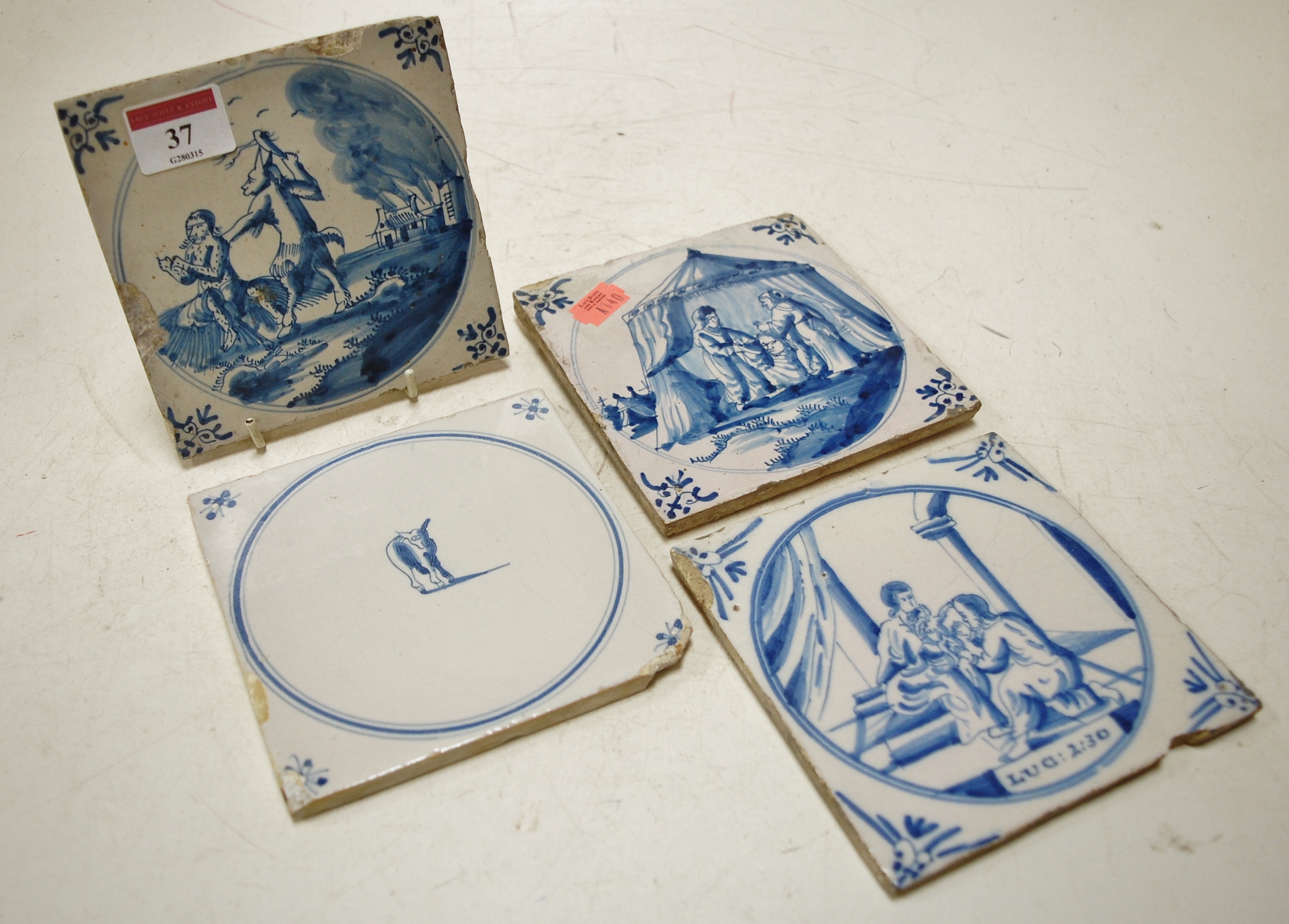 Four 19th century Delft blue and white t