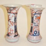 A pair of oriental stoneware vases of tr