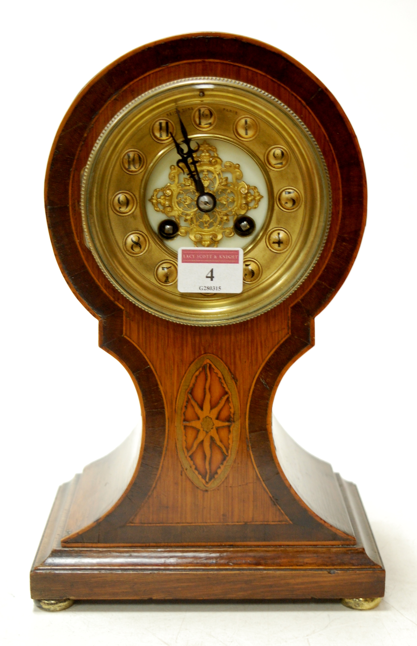 An Edwardian oak cased rosewood cross banded and satinwood inlaid balloon shaped mantel clock having