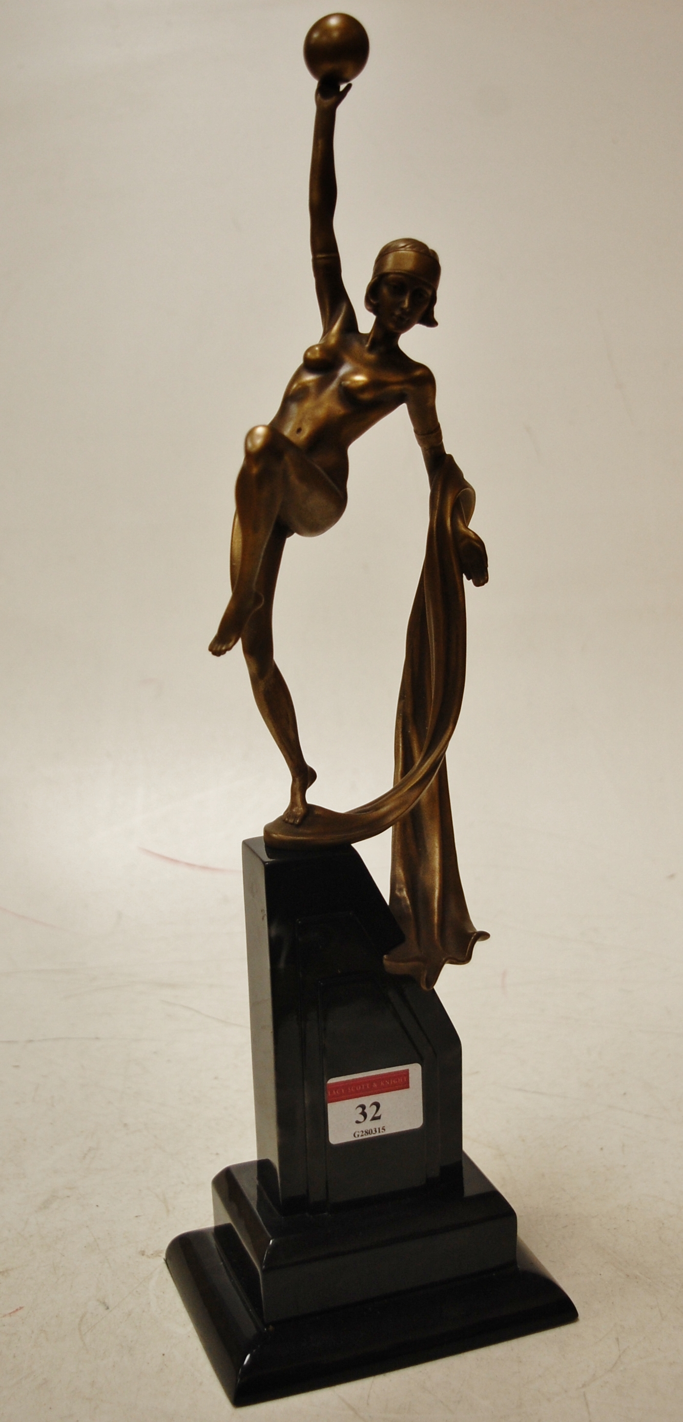 An Art Deco style resin figure of a danc