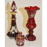 Ruby glass scent bottle and stopper with gilt enamel decoration and two other pieces of ruby