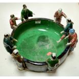 A large modern Chinese stoneware bowl, the rim decorated with various figures in standing pose