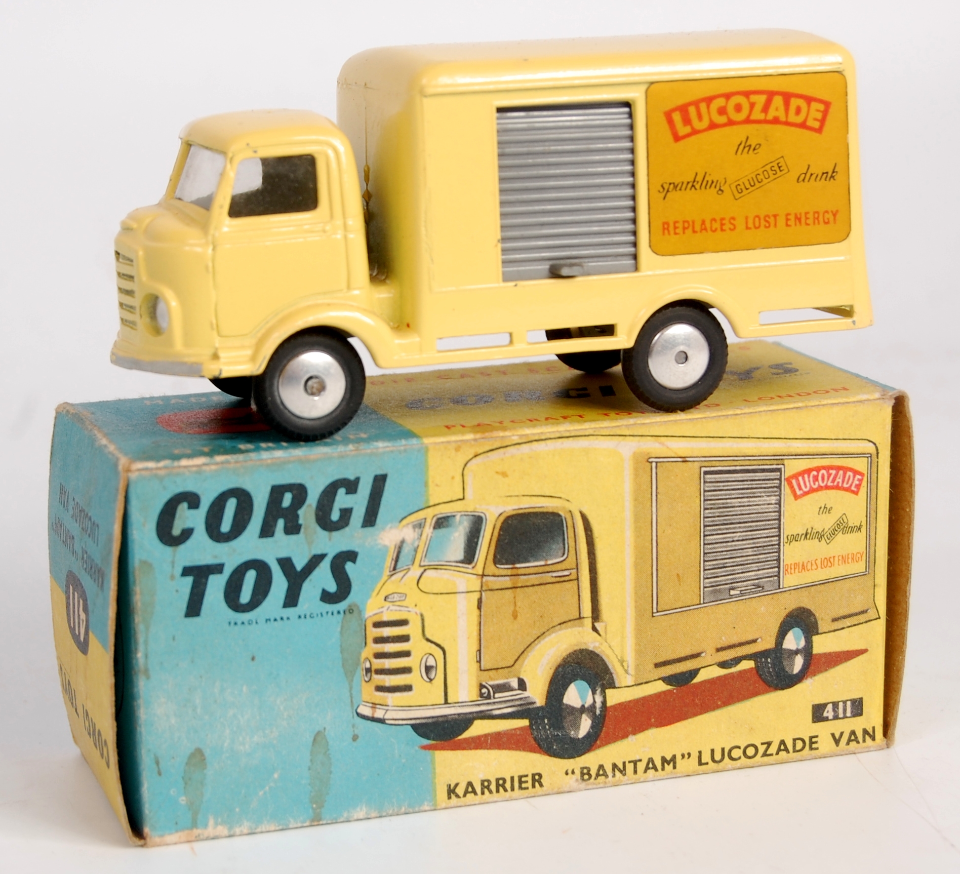 Corgi Toys, 411 Karrier Bantam Lucozade van, yellow body with grey shutter, smooth hubs with