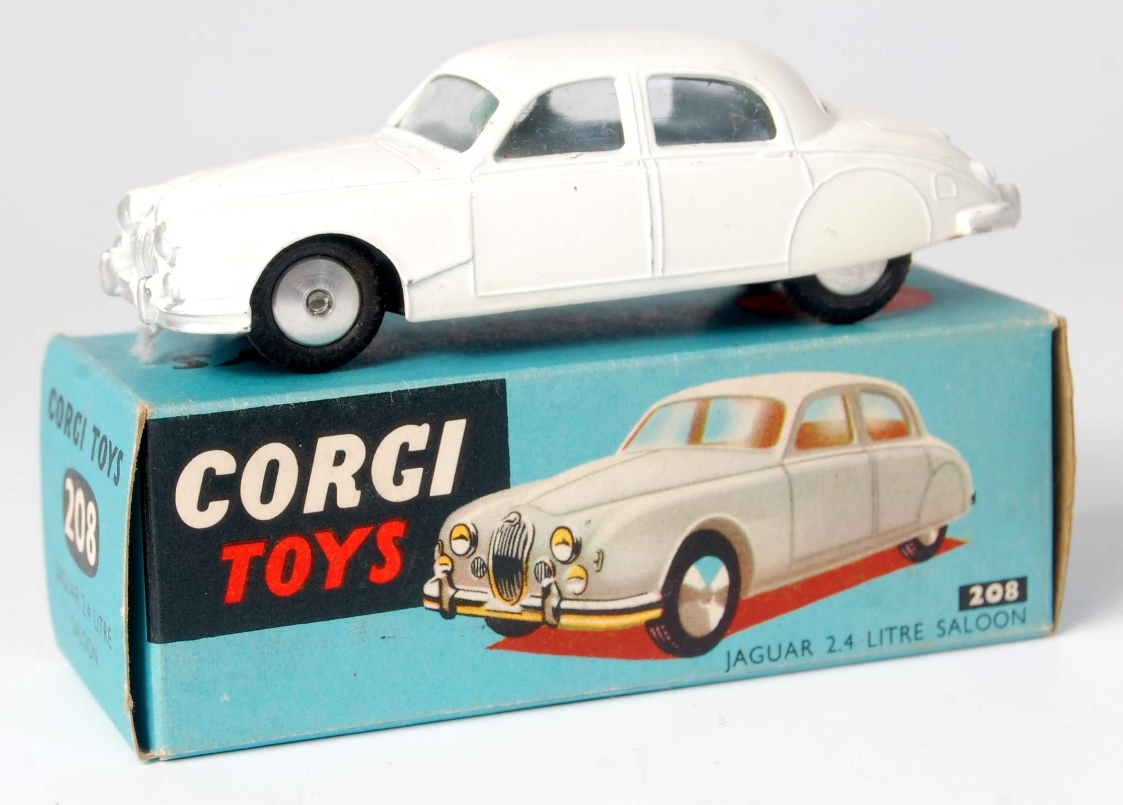 Corgi Toys, 208 Jaguar 2.4 litre, white body with silver detailing, flat spun hubs with glazing, in