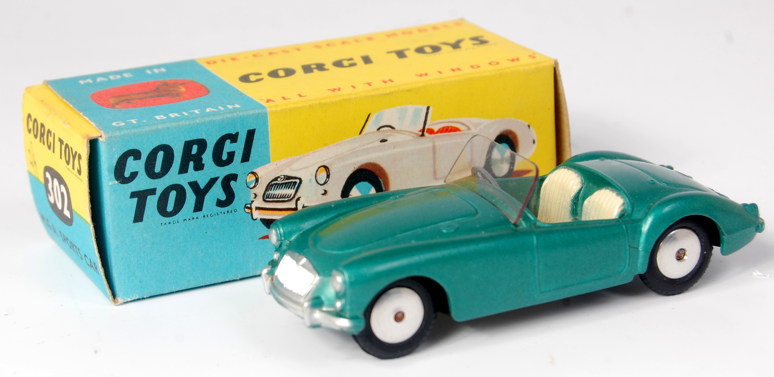 Corgi Toys, 302 MGA sports car, dark metallic green body with cream seats, smooth spun hubs, in the