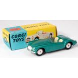 Corgi Toys, 302 MGA sports car, dark metallic green body with cream seats, smooth spun hubs, in the