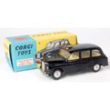 Corgi Toys, 418 Austin FX4 taxi, black body with lemon interior, no driver, flat spun hubs, in the