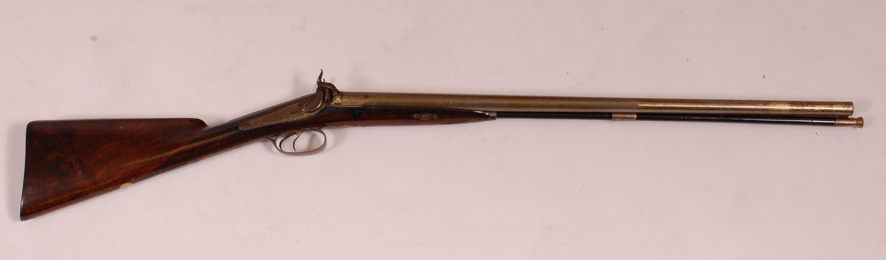 A 19th century double barrelled percussion cap rifle,
