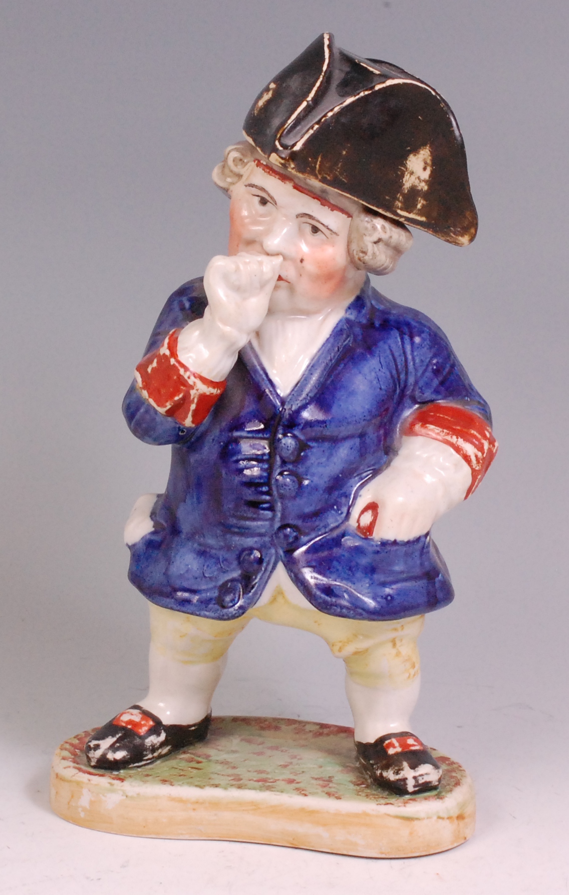 A Victorian Staffordshire standing Toby taking snuff, wearing a black removable tricorn hat,