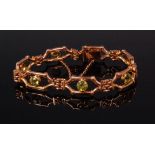 A ladies 15ct gold and green peridot set gatelink bracelet, with safety chain,