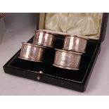 A cased set of four Walker & Hall silver napkin rings,