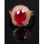 A contemporary 14ct yellow gold ruby and diamond cluster ring,