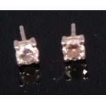 A pair of 18ct white gold diamond ear studs, the four claw set brilliants each weighing approx. 0.