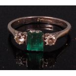 A ladies platinum emerald and diamond dress ring,