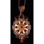 An 18ct gold enamel ruby and diamond set pendant, having a centre claw set ruby weighing approx. 0.