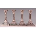 A set of four James Dixon & Sons silver candlesticks, each having beaded detachable sconces,