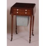 A Regency mahogany needlework table, having fall flaps and two drawers above a silk lined well, w.